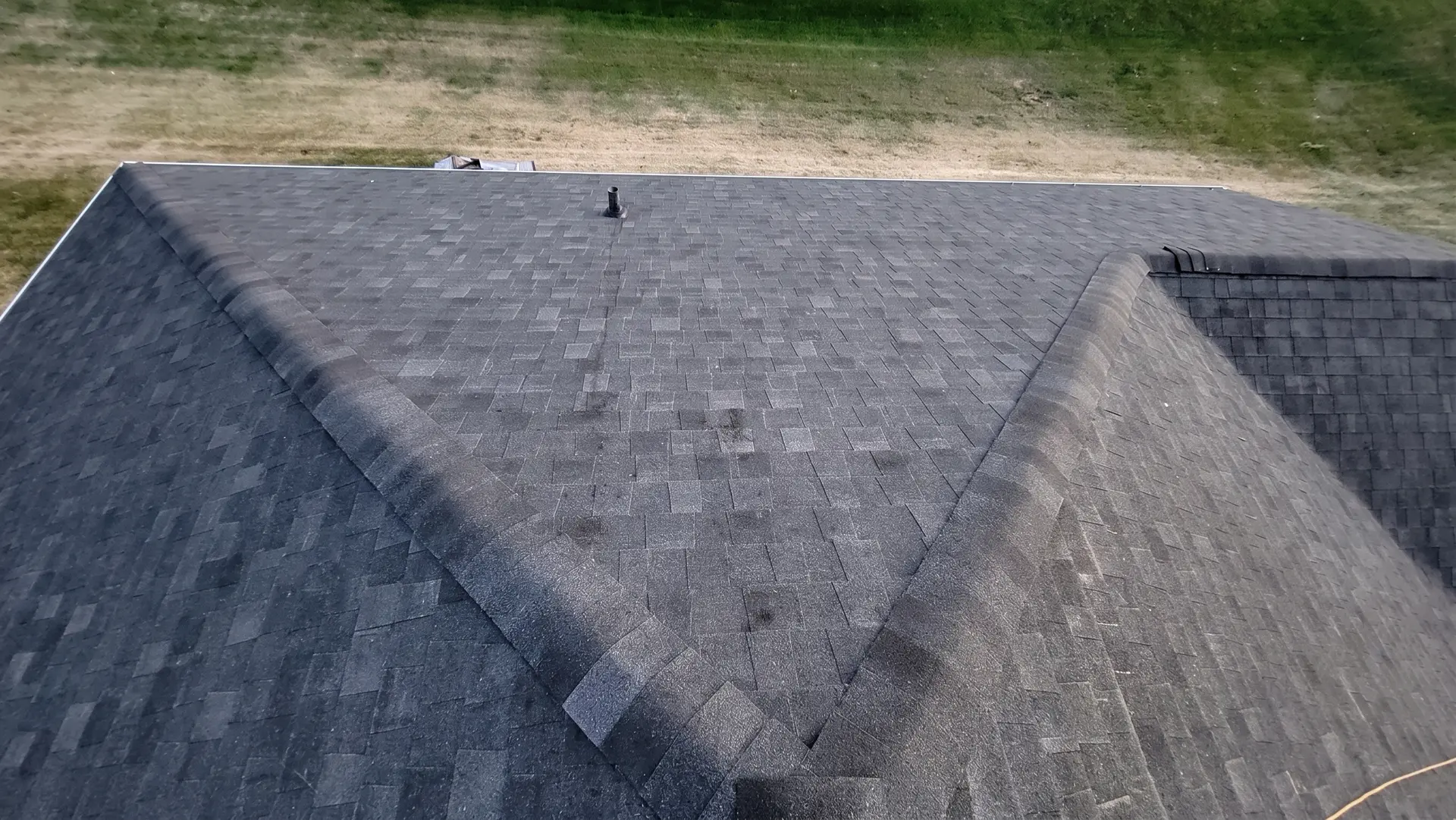 Aerial view of a new asphalt shingle roof installation by Onsite Contractors