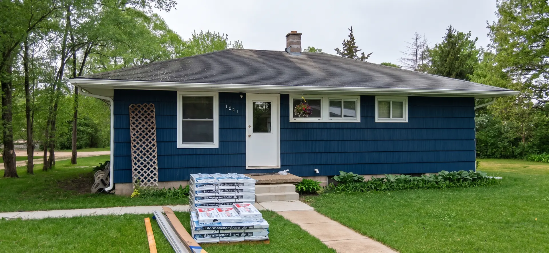 Onsite Contractors crew exterior roofing and siding work